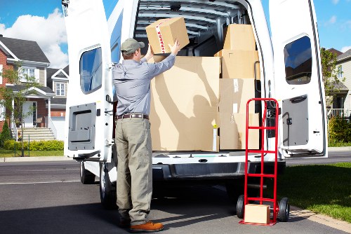 Carefully packed wooden and upholstered furniture in storage