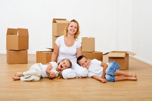 Professional movers handling furniture in Kennington flat